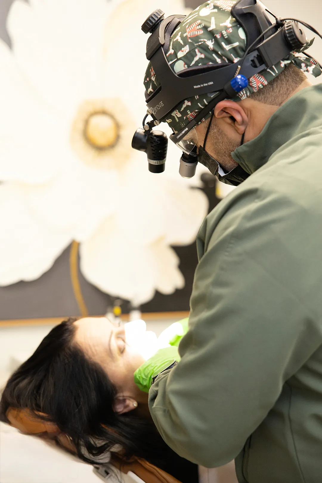 Dentist wearing loupes examining a patient in a dental chair — My Dental Hub in Skokie, IL