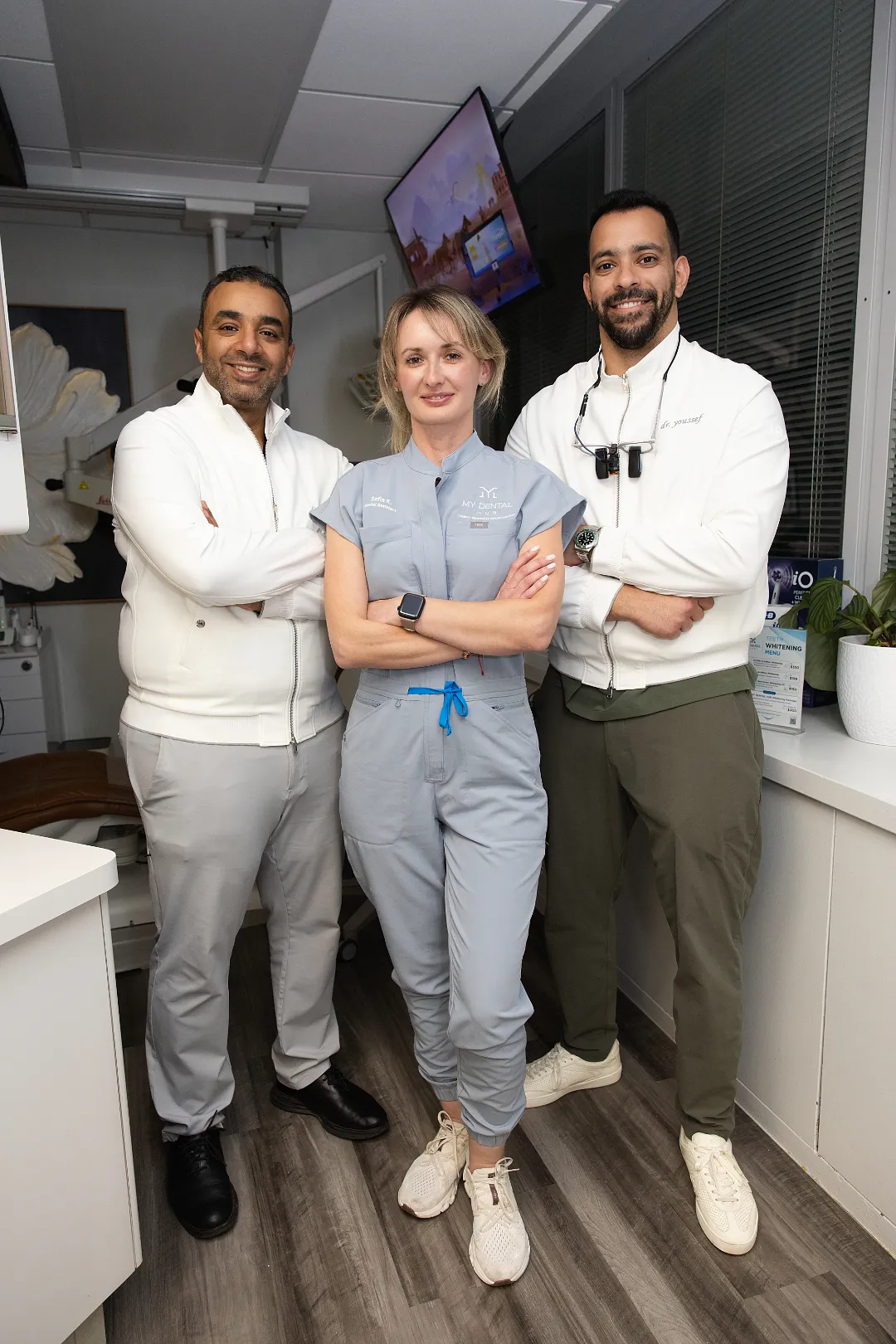 Three dental staff members posing together in an operatory — My Dental Hub in Skokie, IL